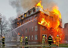 Firefighters had to focus their efforts on saving the adjacent church instead of this burning building, an abandoned convent in Massueville, Quebec, Canada Fire inside an abandoned convent in Massueville, Quebec, Canada.jpg