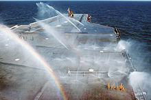 The flight deck washdown system is tested during America's 1976 Mediterranean cruise Flight deck washdown system test on USS America (CV-66) 1976.JPEG