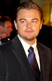 A picture of Leonardo DiCaprio in a suit while he is looking to his left.