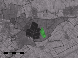 The village centre (dark green) and the statistical district (light green) of Oukoop in the municipality of Reeuwijk.