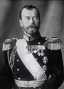 Nicholas is pale-eyed, bearded, of slim build and wearing a uniform and medals.