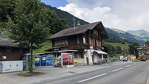 Three-story building with gabled roof