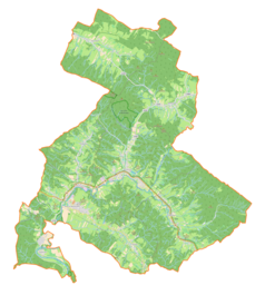Mapa konturowa gminy Olszanica, na dole znajduje się punkt z opisem „Orelec, cerkiew drewniana”