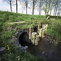 De drie kokers van de sluis aan de polderzijde voor de restauratie