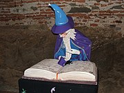 White-haired and -bearded wizard with robes and hat.