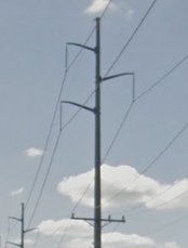 A single-circuit 138 kV line (top) with distribution wires (bottom)