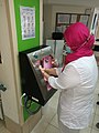A nurse uses a smart hand washing device