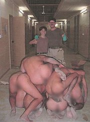 This photograph from Abu Ghraib released in 2006 shows a pyramid of abused Iraqi prisoners. Abu Ghraib 53.jpg