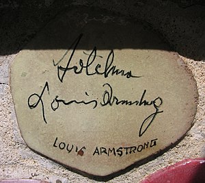 Autograph of Armstrong on the muretto of Alassio