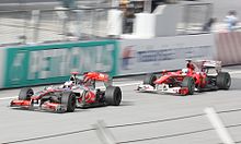 Photo de la McLaren MP4-25 de Button et de la Ferrari F10 d'Alonso à Sepang