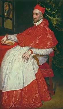 Old painting of a middle-aged white man sitting in a red upholstered chair and wearing the red hat and red-and-white robes of a cardinal in the Catholic Church.