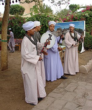 Egyptian musicians wearing gellabiyas (also sp...
