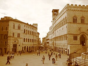 On the right, Palazzo Dei Priori (town hall), ...
