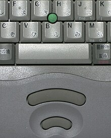 A pointing stick on a mid-1990s-era Toshiba laptop. The two buttons below the keyboard act as a computer mouse: the top button is used for left-clicking while the bottom button is used for right-clicking. Pointing stick Toshiba.jpg