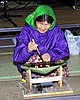 Inuit woman using a qulliq, a seal oil lamp and stove