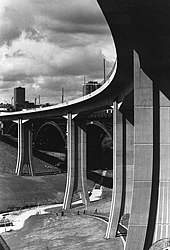 The Byker Viaduct, built for the Metro, was the first such structure in Britain to be built using cantilevered concrete sections with joints glued with epoxy resin. This photograph shows a completed view of the Byker Viaduct in the summer of 1979. (8691414027).jpg