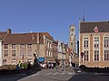 Bruges, street view (de Wollestraat) with belfry in the background