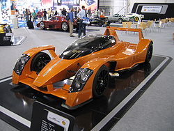 An orange Caparo T1 at the 2006 British Motor Show