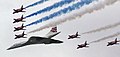 Image 76Concorde (and the Red Arrows with their trail of red, white and blue smoke) mark the Queen's Golden Jubilee. With its slender delta wings Concorde won the public vote for best British design. (from Culture of the United Kingdom)