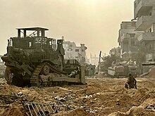 IDF armored D9 bulldozer and Israeli combat engineers near Jabalia - November 2023 IDF D9R bulldozer - Swords of Iron - 2023-11-02.jpg