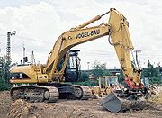 A typical modern excavator:a CAT 325C, fitted with quick coupler and tilting bucket