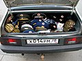 In the picture, there are hats in the trunk of a Russian car.
