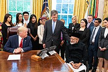 President Donald Trump meets with survivors of religious persecution from 17 countries in July 2019. President Trump Meets with Survivors of Religious Persecution (48314955692).jpg