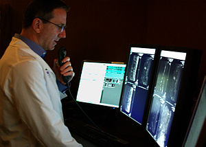 A radiologist interprets medical images on a m...