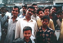 A group of ethnic Bengalis in Dhaka, Bangladesh. The Bengalis form the third-largest ethnic group in the world after the Han Chinese and Arabs. Watching you (Bangladesh).JPG