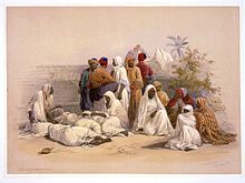 Barefooted slaves depicted in David Roberts' Egypt and Nubia, issued between 1845 and 1849 A slave market in Cairo-David Roberts.jpg