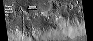 Channels, as seen by HiRISE under HiWish program. Stream appears to have eroded through a hill.