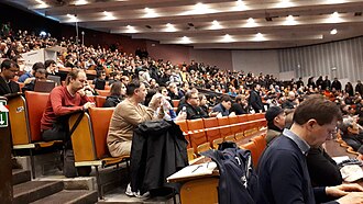 A characteristically crowded main session at FOSDEM