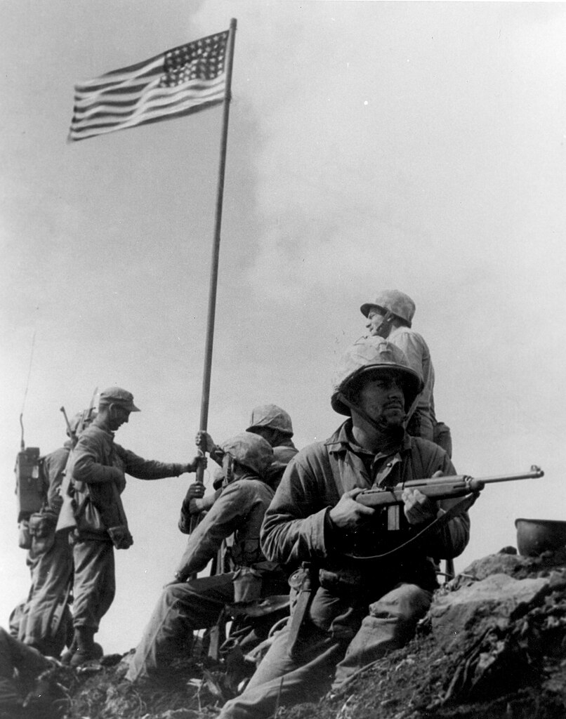 http://upload.wikimedia.org/wikipedia/commons/thumb/9/92/First_Iwo_Jima_Flag_Raising.jpg/806px-First_Iwo_Jima_Flag_Raising.jpg