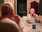Broadway actor Jim Brochu applies make-up before the opening night of a play.