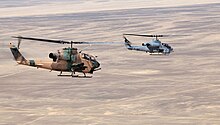 On the right a AH-1W showing its twin exhaust, compared to the single on the AH-1F (left) Jordanian AH-1F and AH-1W of USMC.jpg