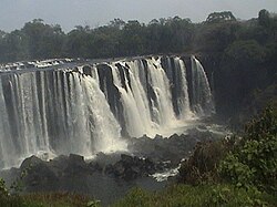 Stream of water gushing out from a falls