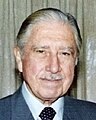 Augusto Pinochet ruled Chile as a dictator from 1973 to 1990. During his reign, there were widespread reports of torture, and people regularly disappeared. Pinochet also made economic reforms, which benefitted Chile. He put economists in key positions of his government. After a popular vote, Chile returned to democracy, with free elections in 1990. There also were repors on corruption, and Pinochet wanting to evade taxes.