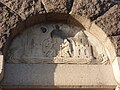 Relief above the entrance door to the tower depicting the Coat of arms of Aarhus.