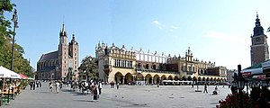 Polish architecture: Main Market Square in Kraków. St Mary's Basilica (left), Sukiennice (centre), Town Hall Tower (right)