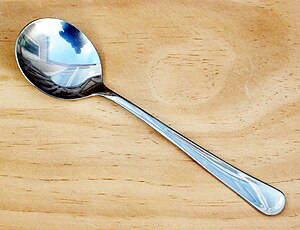 A stainless steel bouillon spoon