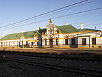 This railway station building with its richly decorated gable was completed in 1896 for the Nederlandsche Zuid Afrikaansche Spoorweg-Maatschappij. It is one of only a few elegant. station buildings erected for the NZASM and is an important link with the T Type of site: Station Building.