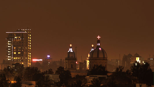 Domes and crosses of the St. Francis Xavier's Cathedral seen against the Bangalore skyline