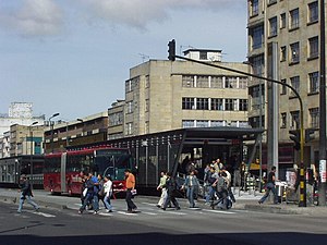 Calle 19 Station(July 2004). One can see the station and the red busses.