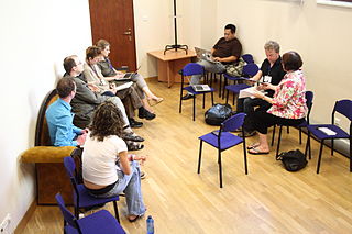 A group of eight people having a discussion