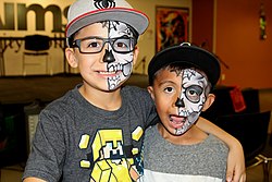 Two Mexican American boys at a Dia de Los Muertos celebration in Greeley, Colorado Dia de Los Muertos Celebration.jpg