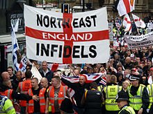 The National Front cooperated with the North West Infidels and South East Alliance, groups that splintered from the English Defence League (rally depicted). EDL2.jpg