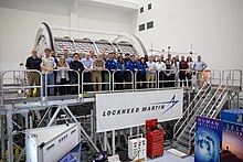 NASA and Lockheed Martin employees group photo with one of the Gateway modules training mock-up inside the SSPF LOP-G module training mock-up module group photo.jpg