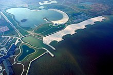 Picture showing the use of artificial headlands and detached breakwaters in a coastal system Maumee Bay State Park aerial view.jpg