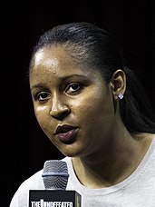 Female speaker at a microphone