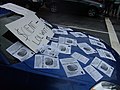 A protester's car is covered with leaflets by fellow protesters.
